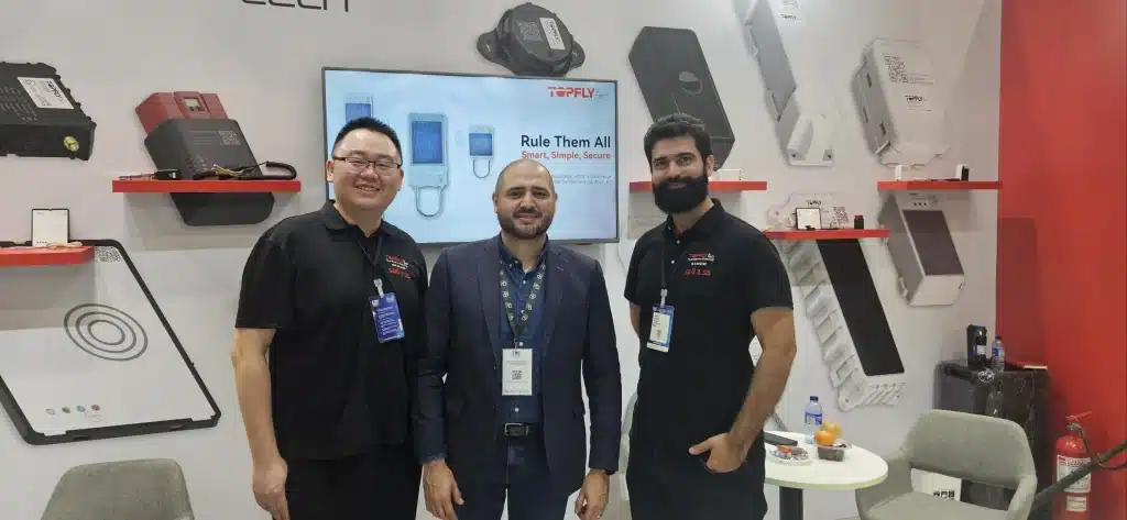TOPFLYtech team with ESS+ representatives during the ESS+ 2026 security and technology exhibition in Bogotá, Colombia.